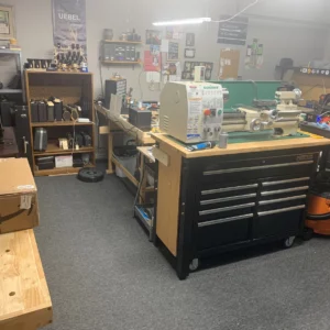Workshop with tools, workbenches, and clarinet equipment.